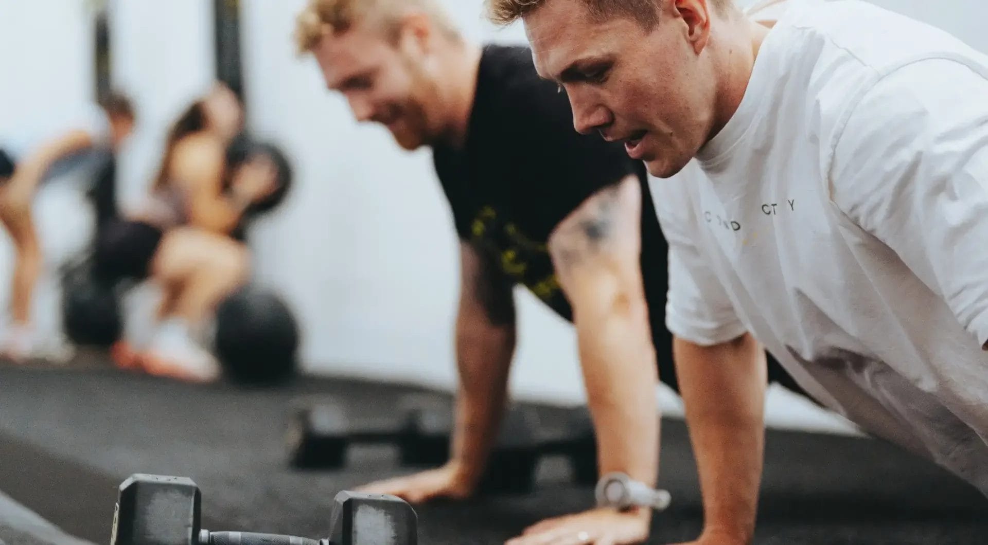men taking a CrossFit class